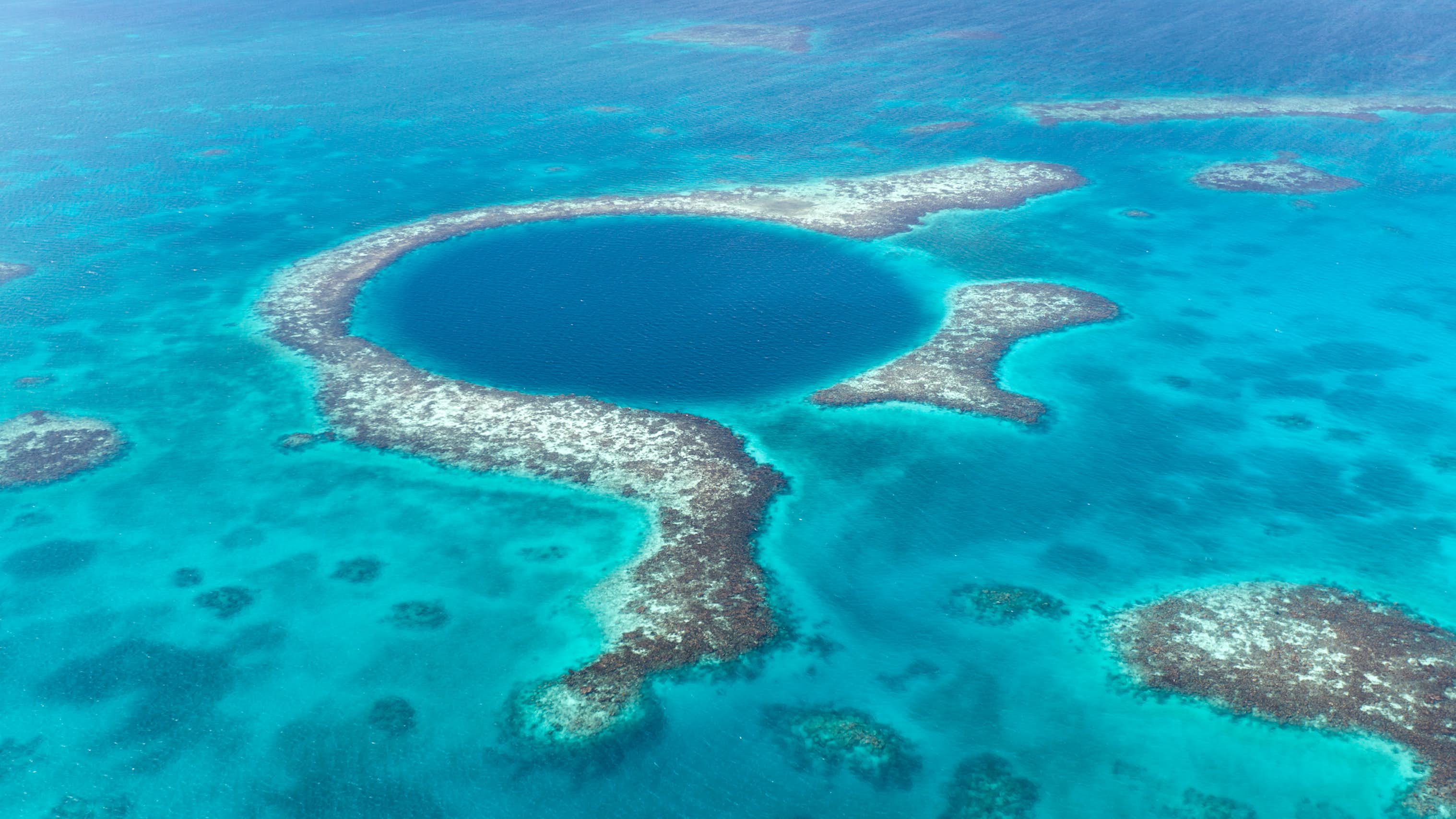 Belize Yacht Charter - Aerial view of the blue hole in Belize