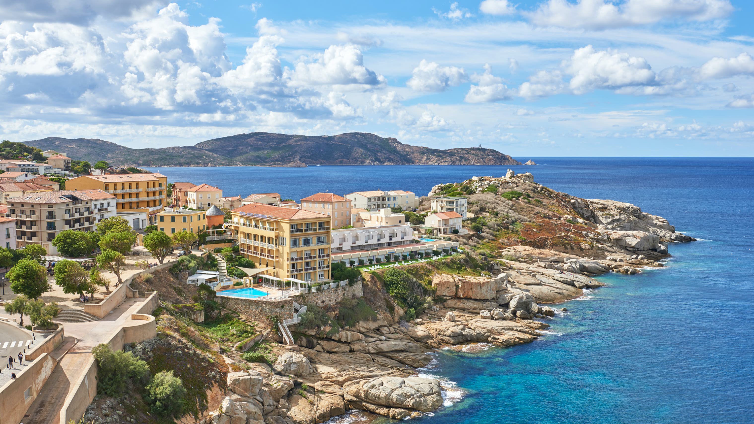 Corsica Yacht Charter Mediterranean - Beautiful buildings along the rocky coastline of Calvi, Corsica, France