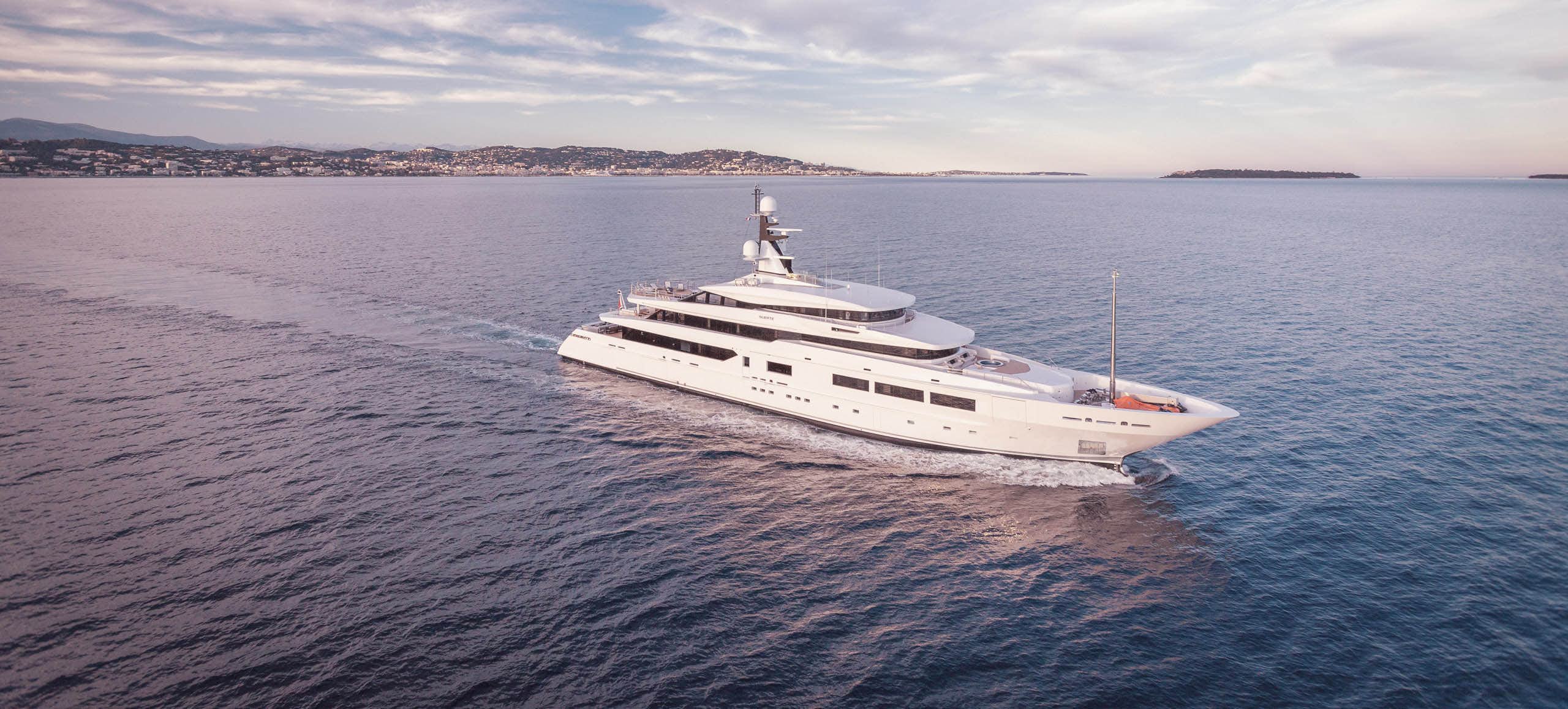Side view of a superyacht cruising in blue sea | Yacht for Sale |N&J